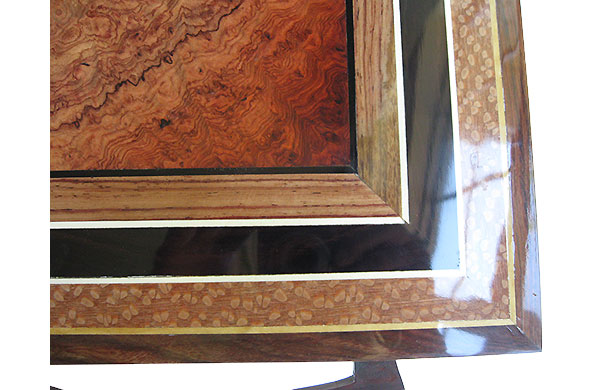 Amboyna burl center framed in Honduras rosewood, African blackwood and lacewood box top - close up
