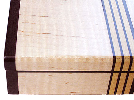 Decorative small wood box close up - Fiddle back maple, ebony, Ceylon satinwood